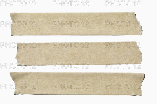 Three straps of masking tape on white background