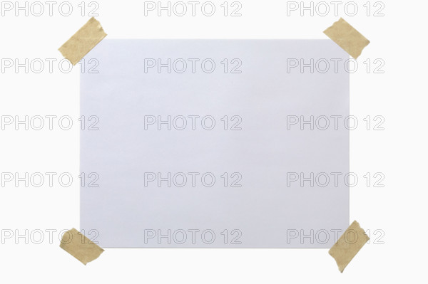 Blank paper taped to white background