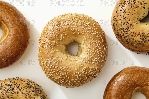 Overhead view of bagels on white background