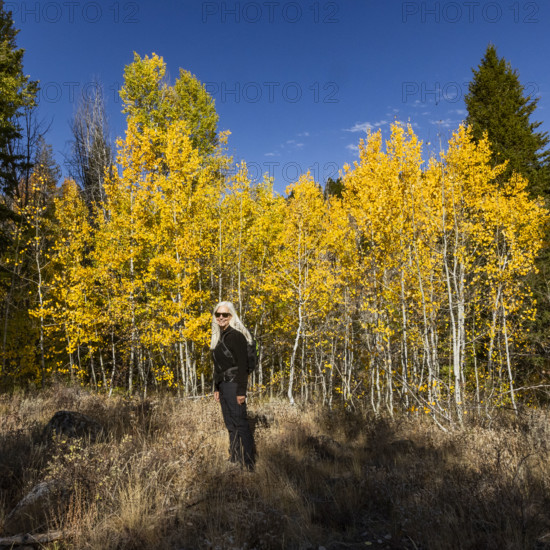Portrait of smiling woman in autumn landscape