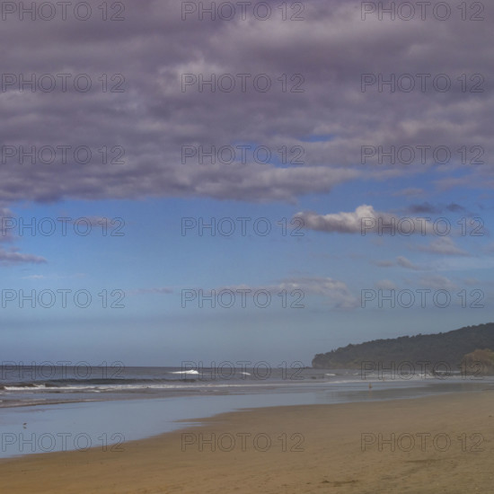 Costa Rica, Guanacaste, Playa Grande, Thick clouds over empty beach
