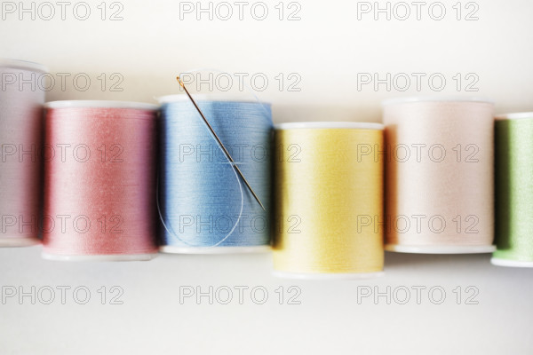 Studio shot of colorful spools of threads