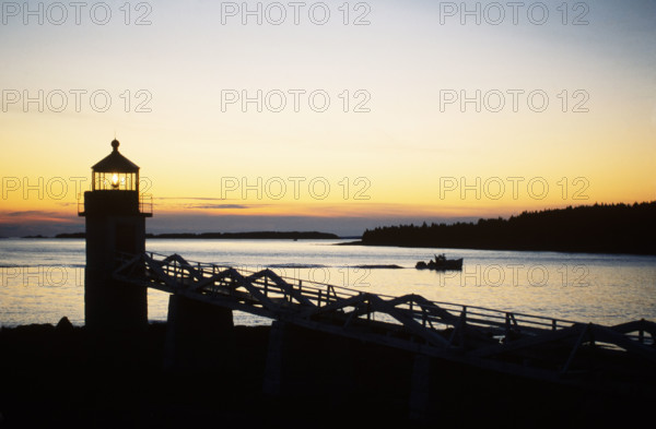 USA, Maine, Port Clyde, Silhouette of Marshall Point Light at sunset