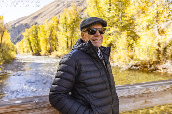 USA, Idaho, Bellevue, Portrait of smiling senior man by river