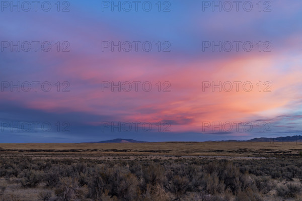 USA, Idaho, Boise, Dramatic sunrise sky above fields