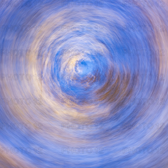 Low angle view of trees against sky motion blur