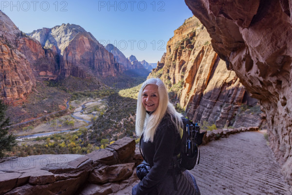 USA, Utah, Zion National Park, Portrait of senior woman on trail to Angels Landing