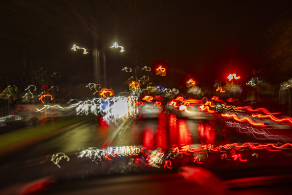 Motion blur night traffic in rain