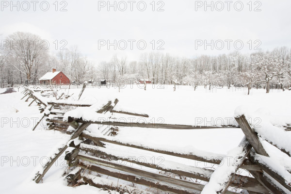USA, New Jersey, Morristown, Field and fence covered with snow at Morristown National Historical Park