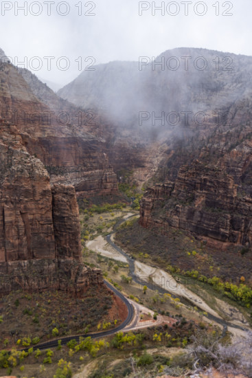 USA, Utah, Zion National Park, Cloud and fog above cliffs at Zion Canyon