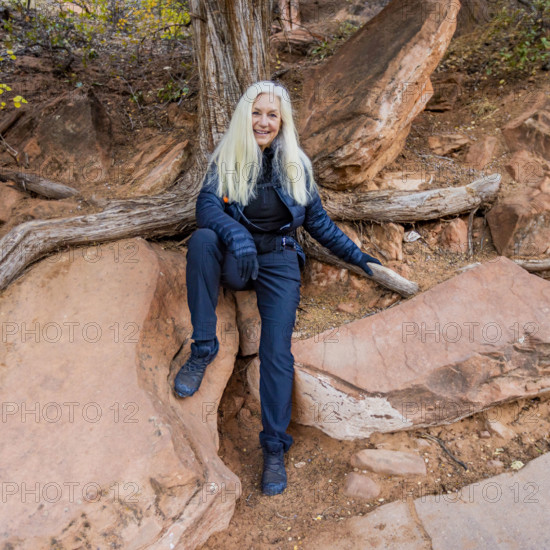 USA, Utah, Zion National Park, Portrait of smiling woman on Angels Landing Trail