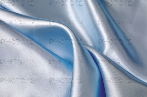 Close-up of folded light blue silk