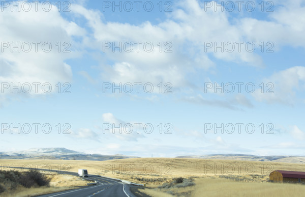 USA, Idaho, Single truck on highway in landscape