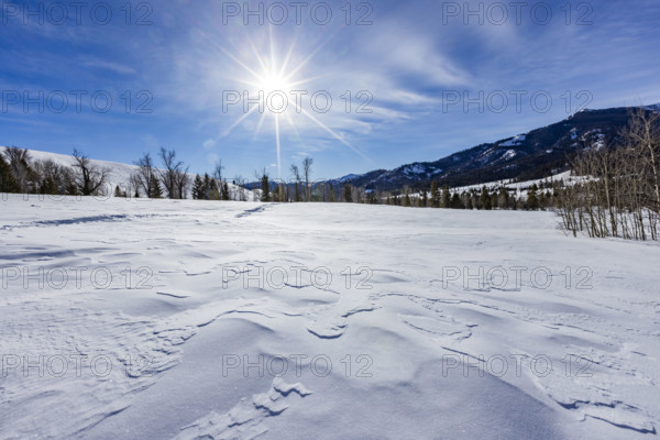 USA, Idaho, Sun Valley, Sun shining above winter landscape