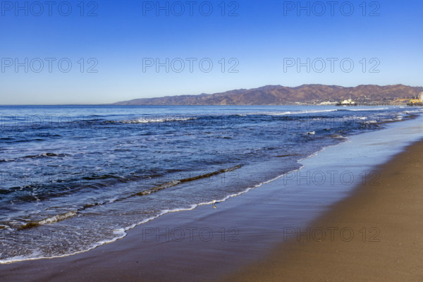 USA, California, Santa Monica, Calm ocean waves on empty Santa Monica Beach