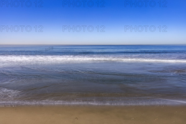 USA, California, Santa Monica, Calm ocean waves on empty Santa Monica Beach