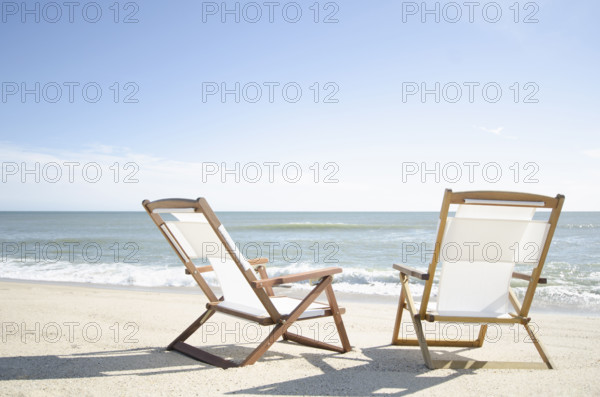 Two deck chairs on empty Madaket Beach. Nantucket, Massachusetts, USA.