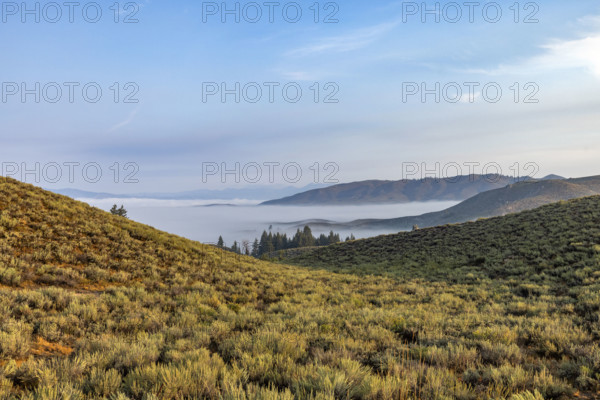 Fog over lowlands from Cat Creek Summit. Mountain Home, Idaho, USA.