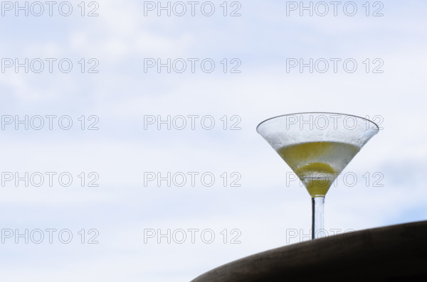 Low angle view of Martini on outdoor table against sky. Stillwater, New Jersey, USA.