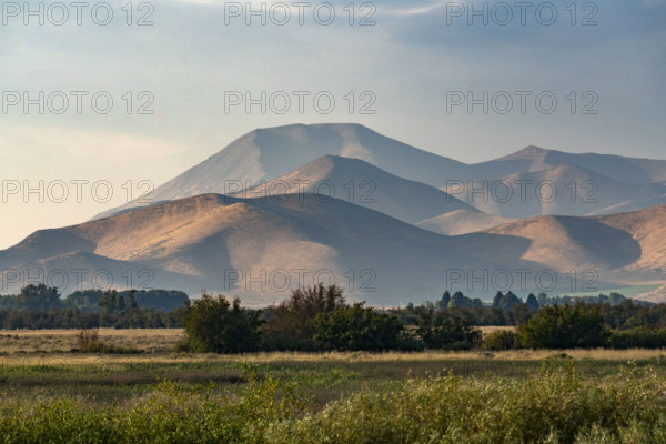 Fields and hills in late afternoon light. Bellevue, Idaho, USA.