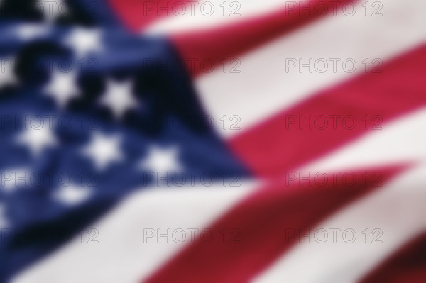 Close-up of defocused American flag. New York City, New York State, USA.