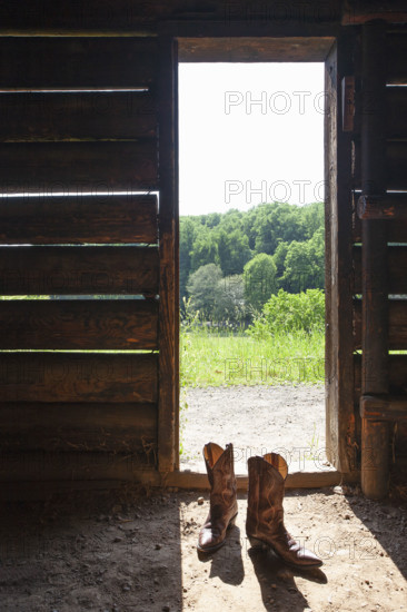 Cowboy boots at barn door. Nashville, Tennessee, USA.