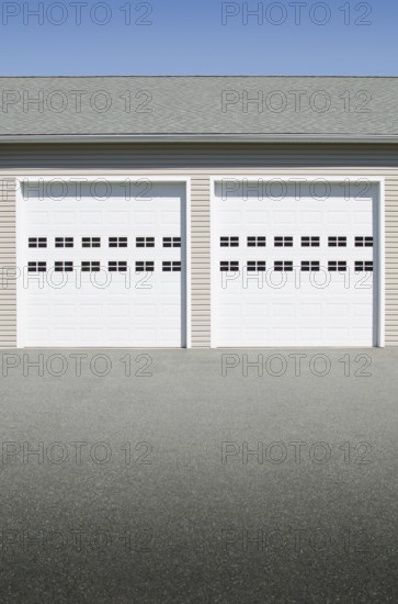 Closed garage doors on sunny day. Mendham, New Jersey, USA.