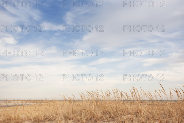 White clouds above empty Lighthouse Beach, Chatham, Massachusetts, USA.