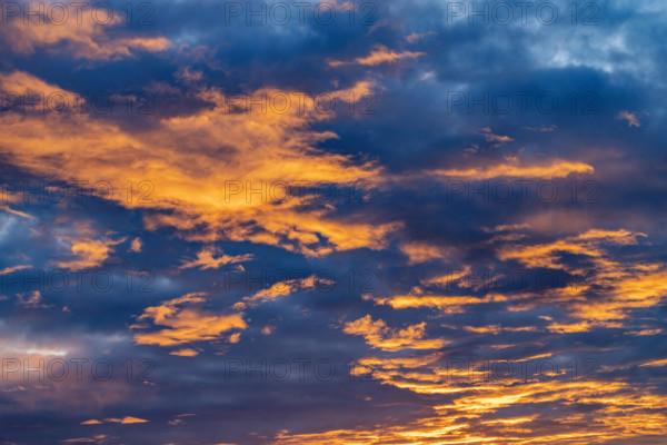Golden clouds against sky at sunrise, Kettleman City, California, USA.