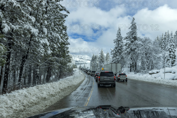 Traffic on highway in Winter seen from car, Truckee, California, USA.