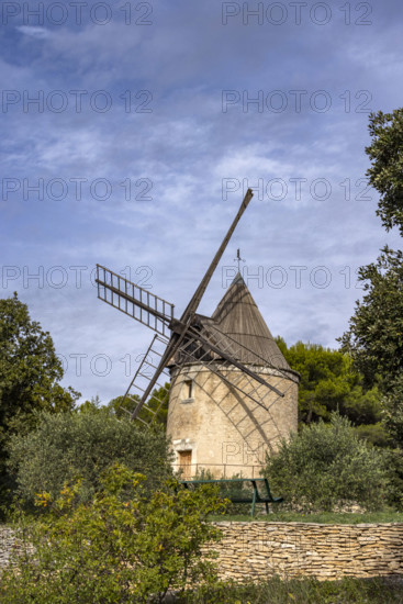 Antique windmill in rural landscape, Gordes, Vaucluse, France.