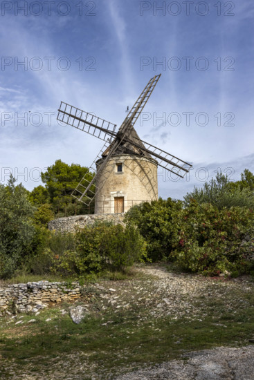 Antique windmill in rural landscape, Gordes, Vaucluse, France.