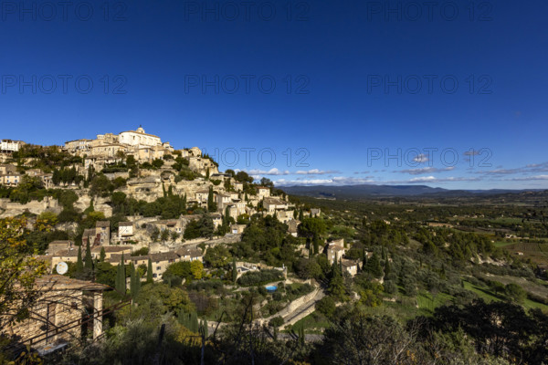 Old town on hill on sunny day, Gordes, Vaucluse, France.