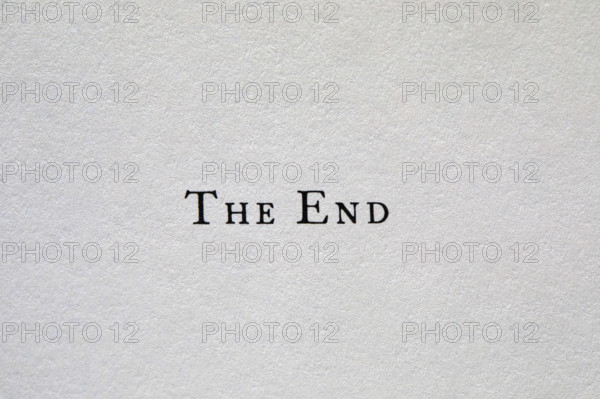 The End typed on white paper, New York City, New York, USA.