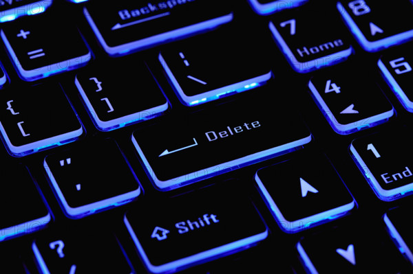 Close-up of laptop keyboard with Delete key, New York City, New York, USA.