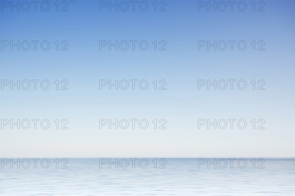 Clear morning sky above calm surface of North Atlantic, Nantucket, Massachusetts, USA.