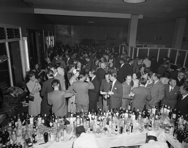 Morris Minor party. Party held to celebrate the Morris Minor record attempt trip undertaken by racing drivers John Manussis and Jim Heather-Hayes. Kenya, 9 September 1954. Aba, Abd Allah, Kenya, Eastern Africa, Africa.