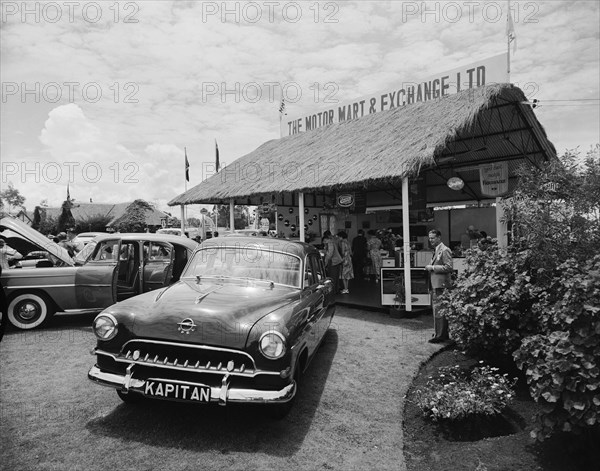 Opel Kapitan. An Opel Kapitan car at the Motor Mart and Exchange Ltd, displayed as part of the Royal Show. Nakuru, Kenya, 1 October 1954. Nakuru, Rift Valley, Kenya, Eastern Africa, Africa.