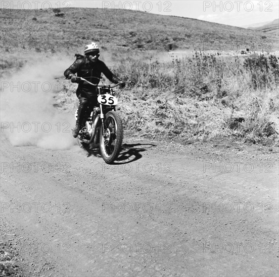 Number 35. Motorcycle rider Ayub, number 35, competing in the Menengai hill climb. Menengai hill, Nakuru, Kenya, 12 December 1954. Nakuru, Rift Valley, Kenya, Eastern Africa, Africa.