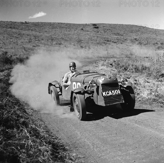 Barrett takes a corner. Racing driver Bob Barrett representing Skoda in the Menengai hill climb. Menengai hill, Nakuru, Kenya, 12 December 1954. Nakuru, Rift Valley, Kenya, Eastern Africa, Africa.
