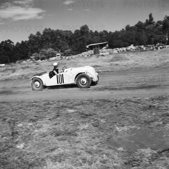 Number 101. An Anglia Special racing car driven by Zelda Hughes, competes in race number nine at the Eldoret race meeting. Eldoret, Kenya, 27 December 1954. Eldoret, Rift Valley, Kenya, Eastern Africa, Africa.