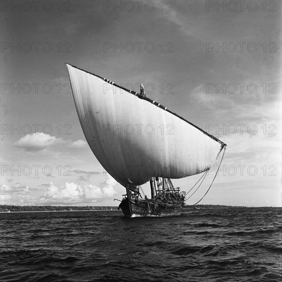 Dhow at sea. A small dhow sailing off the coast of Zanzibar (now Tanzania) in the Indian ocean. Zanzibar (Tanzania), 3-12 March 1953., Zanzibar Central/South, Tanzania, Eastern Africa, Africa.