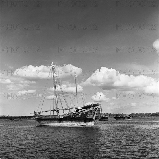 Dhows in a harbour. Dhows in a harbour off the coast of Zanzibar (now Tanzania) in the Indian ocean. Zanzibar (Tanzania), 3-12 March 1953., Zanzibar Central/South, Tanzania, Eastern Africa, Africa.