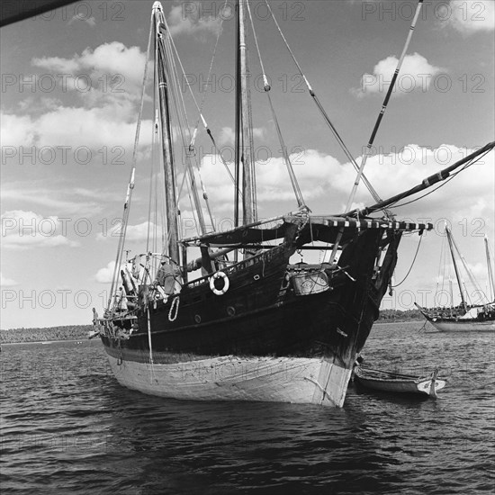 Dhow in a harbour. A dhow in a harbour off the coast of Zanzibar (now Tanzania) in the Indian ocean. Zanzibar (Tanzania), 3-12 March 1953., Zanzibar Central/South, Tanzania, Eastern Africa, Africa.
