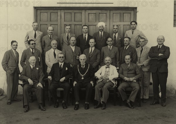 Members of Mombasa Town Council. Group portrait of 21 members of the Mombasa Town Council. The men in the photograph are mostly European, but there is a sprinkling of Indian and Eurasian members, including one Sikh. There are no black African members. Mombasa, Kenya, circa 1930. Mombasa, Coast, Kenya, Eastern Africa, Africa.