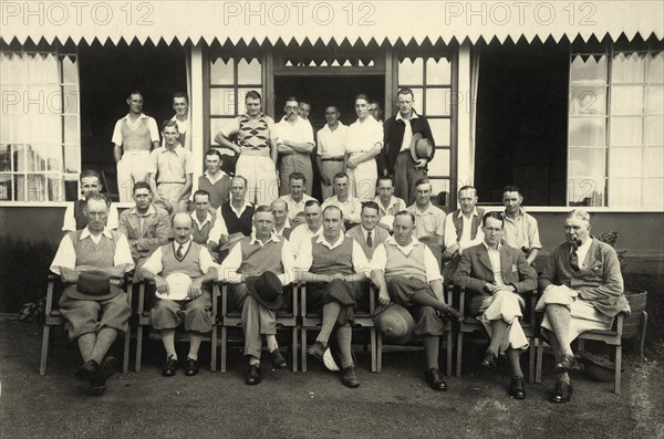 Railway golfers at Muthaiga Club. Informal outdoors portrait of a group of European men wearing plus-fours in front of a clubhouse. Nairobi, Kenya, 14 May 1933. Nairobi, Nairobi Area, Kenya, Eastern Africa, Africa.