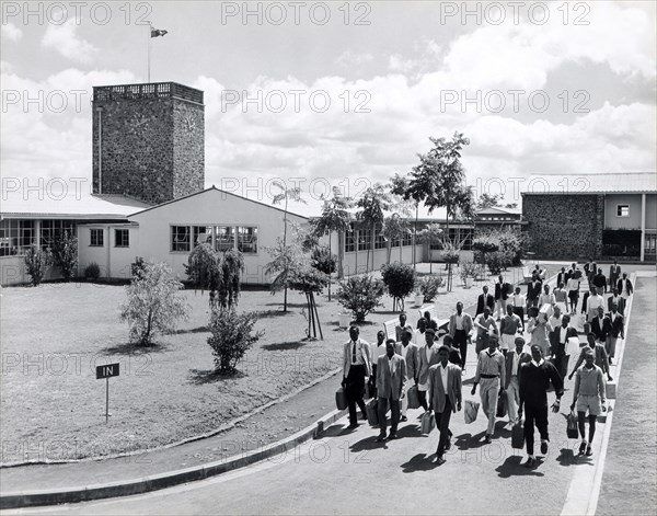 Railway training school. A publicity photograph from the East African Railways and Harbours Administration (EAR&H) showing male students and staff leaving the railway training school. Nairobi, Kenya, circa 1960. Nairobi, Nairobi Area, Kenya, Eastern Africa, Africa.