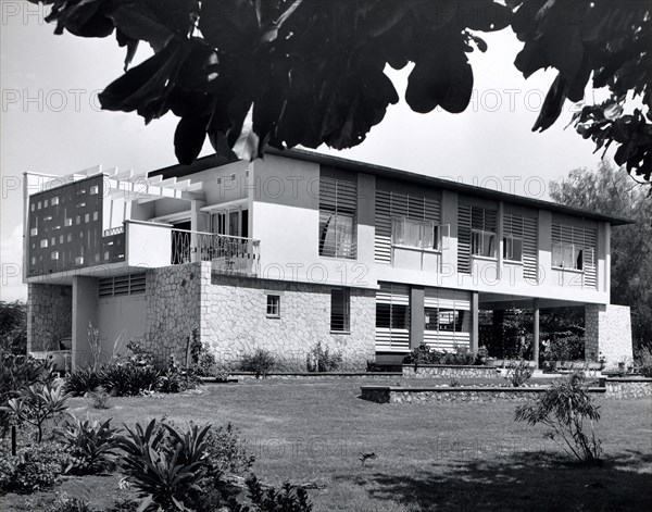 Railway housing, Tanganyika Territory. A publicity photograph from the East African Railways and Harbours Administration (EAR&H) showing landscaped company housing for senior staff. Dar es Salaam, Tanganyika Territory (Tanzania), circa 1960. Dar es Salaam, Dar es Salaam, Tanzania, Eastern Africa, Africa.