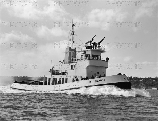 Port tug 'Nguvu'. A publicity photograph from the Port Division of the East African Railways and Harbours Administration (EAR&H) showing the port tug boat 'Nguvu' (from the Swahili for 'strong'). Tanganyika Territory (Tanzania), circa 1955. Tanzania, Eastern Africa, Africa.