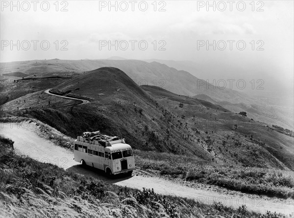 Bus on the Chunya escarpment. A publicity photograph from the East African Railways and Harbours Administration (EAR&H) showing one of its buses on the Chunya escarpment near Mbeya. Tanganyika Territory (Tanzania), circa 1950., Mbeya, Tanzania, Eastern Africa, Africa.